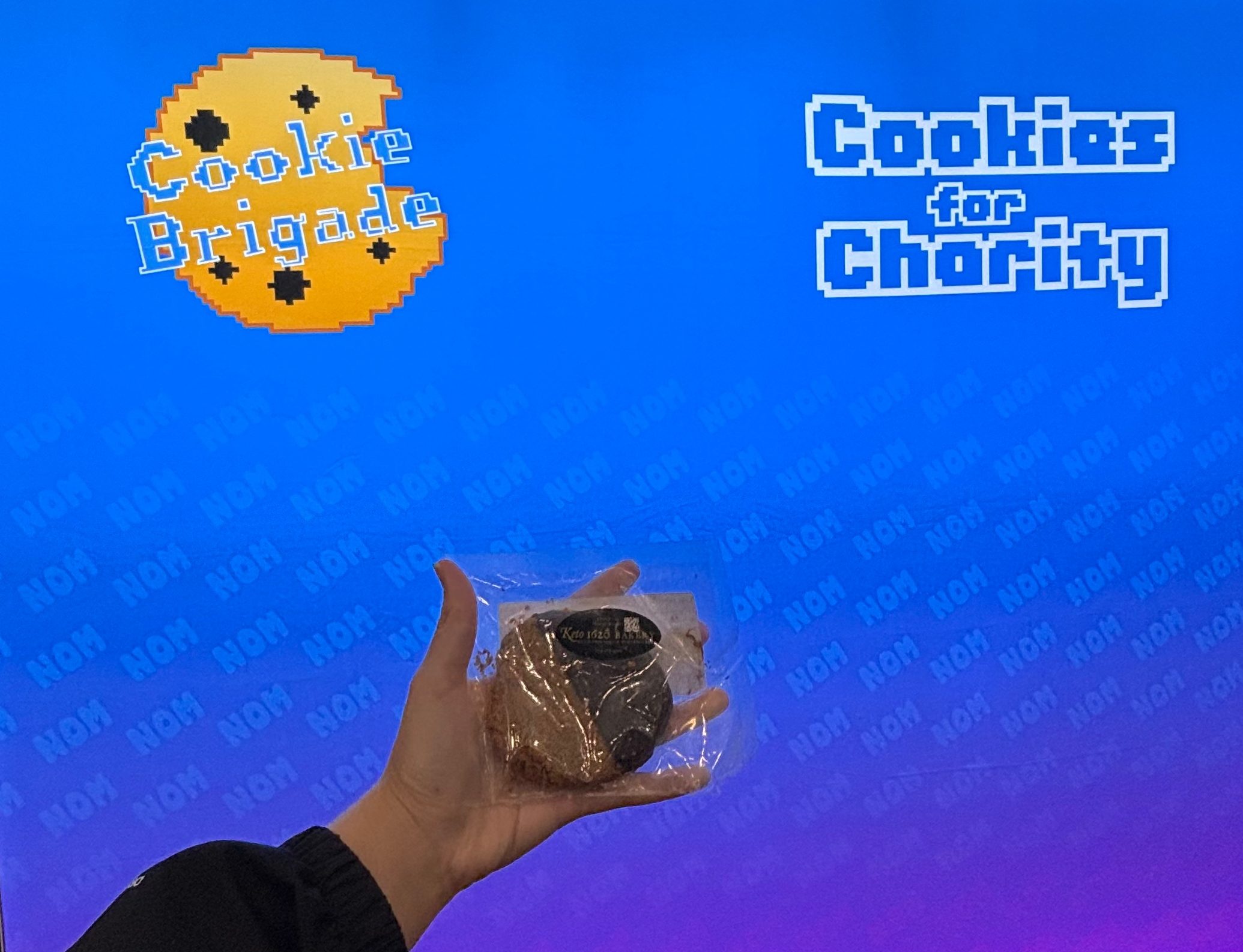 PAX East Cookie Brigade Booth with hand holding cookie